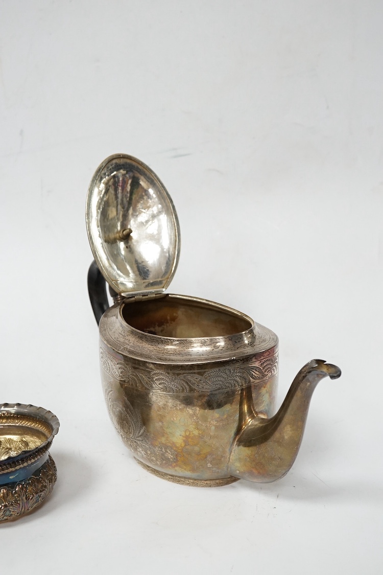 A George III engraved silver oval teapot, by John Eames, London, 1803, together with an early Victorian engraved silver milk jug, Edward Barton, London, 1837 and a late Victorian embossed silver sugar bowl by Josiah Will